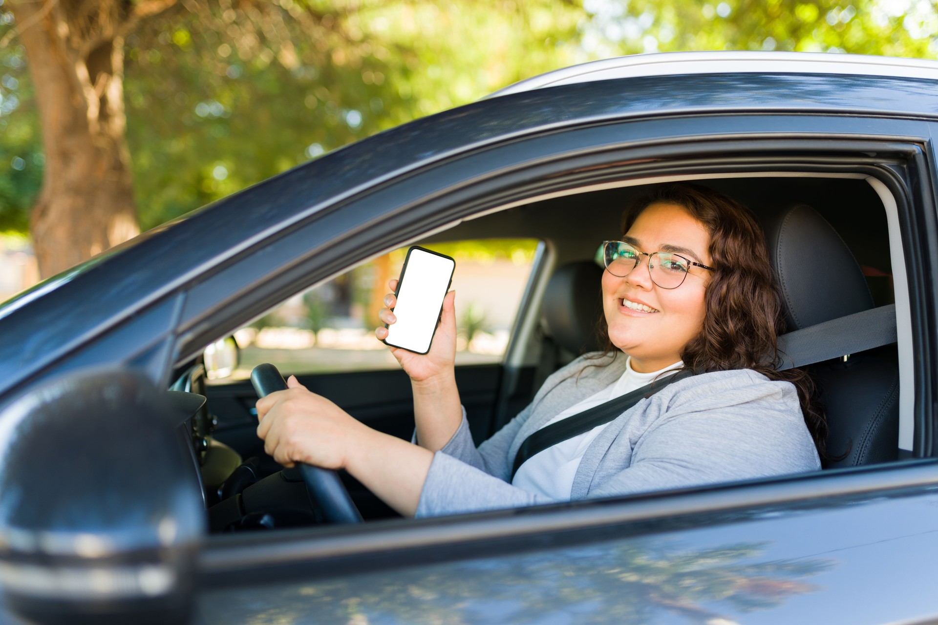 Obese woman driver working on a rideshare app