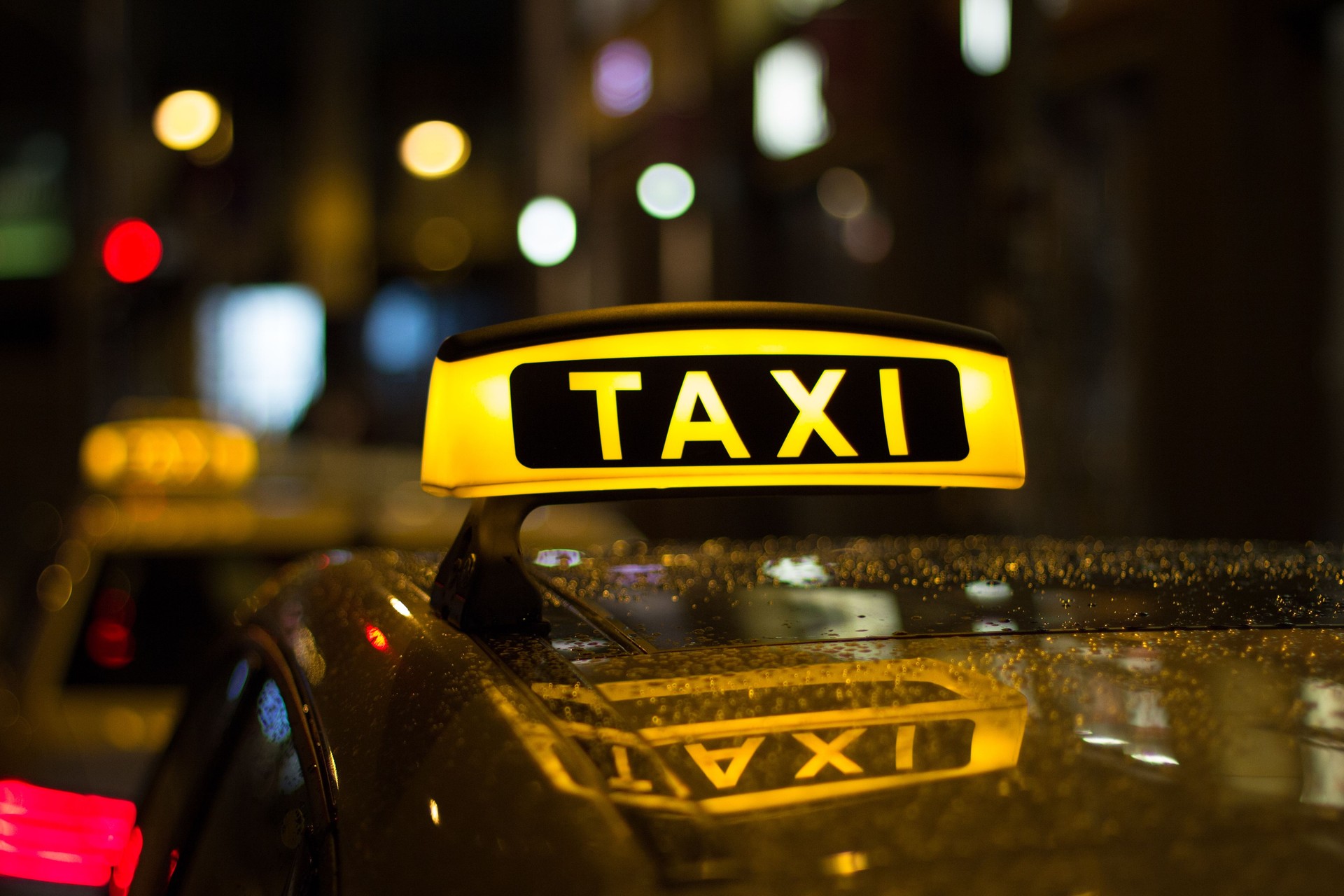 taxi sign at night , taxi cars